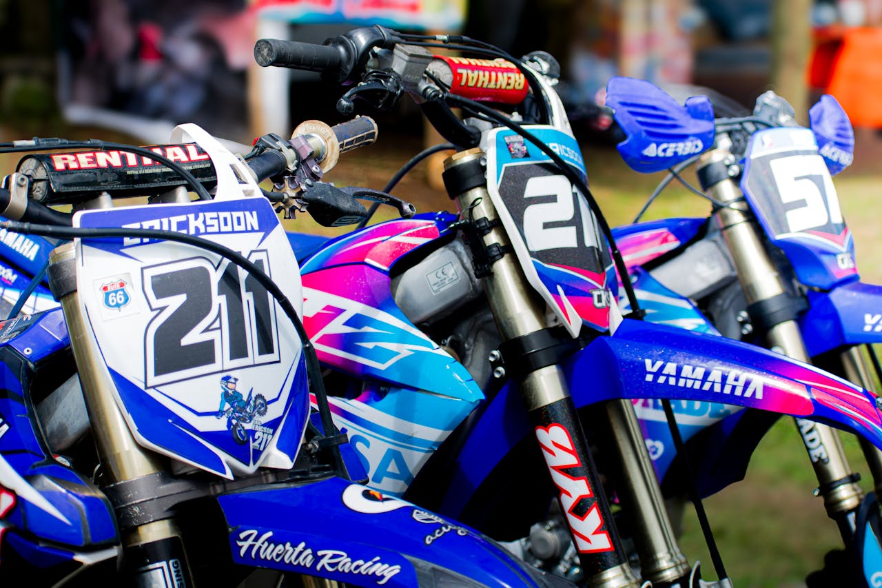 Vibrant motorbikes in line at a motocross event in Ciudad de México.